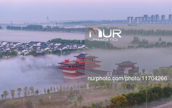 The Wafang Village is seen in the morning mist in Suqian, China, on October 24, 2024. In recent years, in combination with water environment...