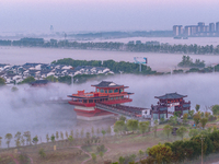 The Wafang Village is seen in the morning mist in Suqian, China, on October 24, 2024. In recent years, in combination with water environment...