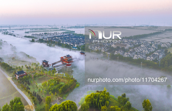 The Wafang Village is seen in the morning mist in Suqian, China, on October 24, 2024. In recent years, in combination with water environment...