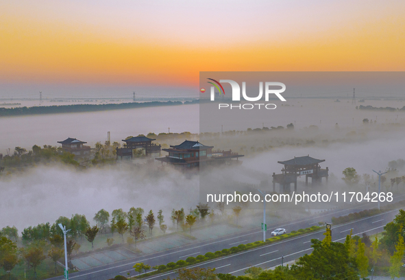 The Wafang Village is seen in the morning mist in Suqian, China, on October 24, 2024. In recent years, in combination with water environment...