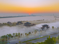 The Wafang Village is seen in the morning mist in Suqian, China, on October 24, 2024. In recent years, in combination with water environment...