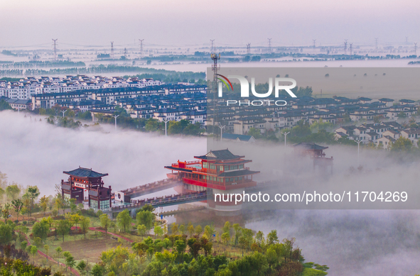 The Wafang Village is seen in the morning mist in Suqian, China, on October 24, 2024. In recent years, in combination with water environment...