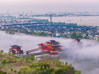 The Wafang Village is seen in the morning mist in Suqian, China, on October 24, 2024. In recent years, in combination with water environment...