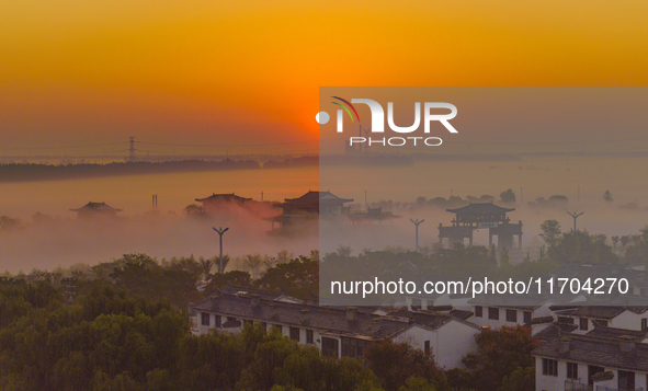 The Wafang Village is seen in the morning mist in Suqian, China, on October 24, 2024. In recent years, in combination with water environment...