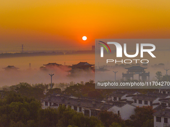 The Wafang Village is seen in the morning mist in Suqian, China, on October 24, 2024. In recent years, in combination with water environment...