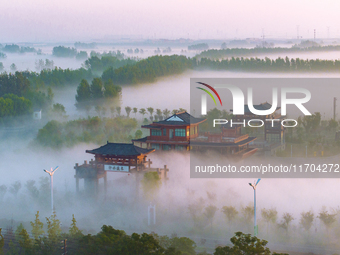 The Wafang Village is seen in the morning mist in Suqian, China, on October 24, 2024. In recent years, in combination with water environment...