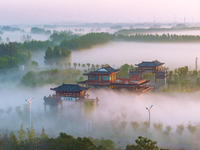 The Wafang Village is seen in the morning mist in Suqian, China, on October 24, 2024. In recent years, in combination with water environment...