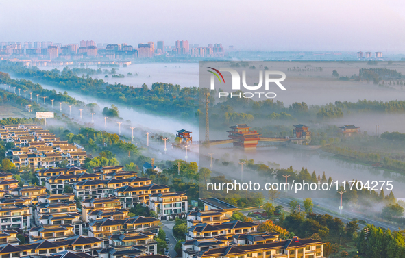 The Wafang Village is seen in the morning mist in Suqian, China, on October 24, 2024. In recent years, in combination with water environment...