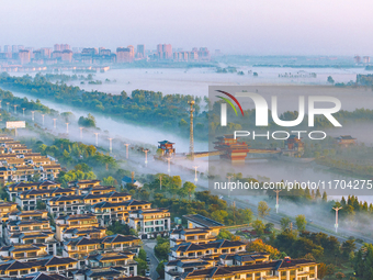 The Wafang Village is seen in the morning mist in Suqian, China, on October 24, 2024. In recent years, in combination with water environment...