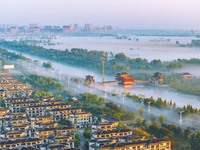 The Wafang Village is seen in the morning mist in Suqian, China, on October 24, 2024. In recent years, in combination with water environment...