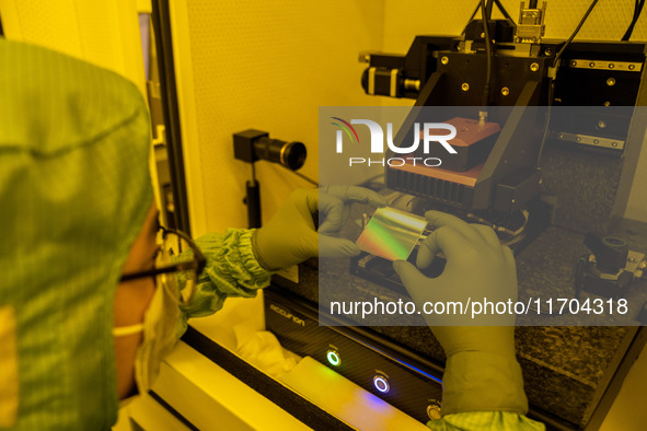 A researcher conducts a grating groove depth test in the yellow light detection room at the research building of Anhui Zhongke Grating Techn...