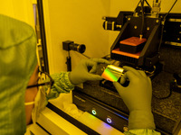 A researcher conducts a grating groove depth test in the yellow light detection room at the research building of Anhui Zhongke Grating Techn...