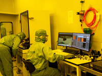 A researcher conducts a grating groove depth test in the yellow light detection room at the research building of Anhui Zhongke Grating Techn...