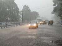 Public vehicles run on the street during the heavy rain due to Cyclone Dana in Kolkata, India, on October 25, 2024. (