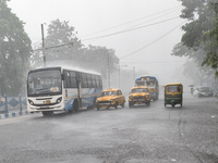 Public vehicles run on the street during the heavy rain due to Cyclone Dana in Kolkata, India, on October 25, 2024. (