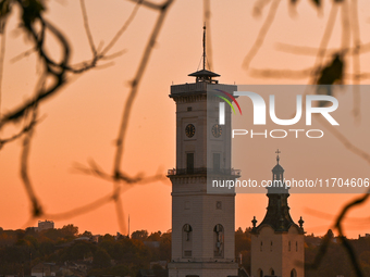 The sun sets over the skyline of Lviv in Lviv, Ukraine, on October 24, 2024. NO USE RUSSIA. NO USE BELARUS. (