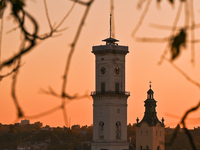 The sun sets over the skyline of Lviv in Lviv, Ukraine, on October 24, 2024. NO USE RUSSIA. NO USE BELARUS. (