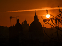 The sun sets over the skyline of Lviv in Lviv, Ukraine, on October 24, 2024. NO USE RUSSIA. NO USE BELARUS. (