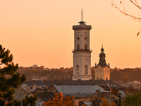 The sun sets over the skyline of Lviv in Lviv, Ukraine, on October 24, 2024. NO USE RUSSIA. NO USE BELARUS. (