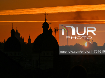 The sun sets over the skyline of Lviv in Lviv, Ukraine, on October 24, 2024. NO USE RUSSIA. NO USE BELARUS. (