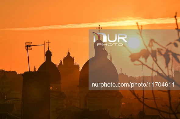 The sun sets over the skyline of Lviv in Lviv, Ukraine, on October 24, 2024. NO USE RUSSIA. NO USE BELARUS. 