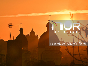 The sun sets over the skyline of Lviv in Lviv, Ukraine, on October 24, 2024. NO USE RUSSIA. NO USE BELARUS. (