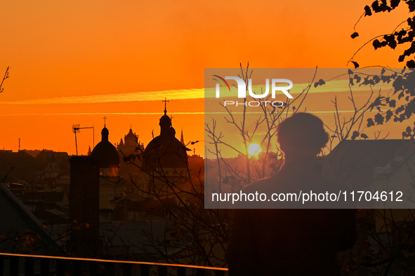 The sun sets over the skyline of Lviv in Lviv, Ukraine, on October 24, 2024. NO USE RUSSIA. NO USE BELARUS. 