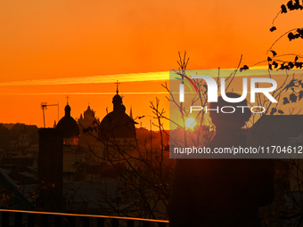 The sun sets over the skyline of Lviv in Lviv, Ukraine, on October 24, 2024. NO USE RUSSIA. NO USE BELARUS. (