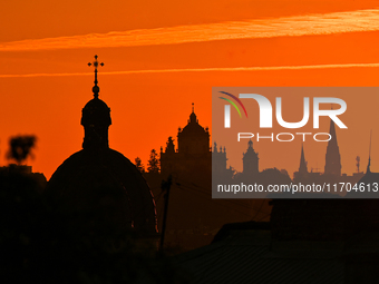 The sun sets over the skyline of Lviv in Lviv, Ukraine, on October 24, 2024. NO USE RUSSIA. NO USE BELARUS. (