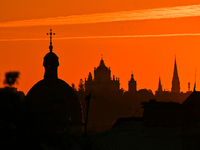 The sun sets over the skyline of Lviv in Lviv, Ukraine, on October 24, 2024. NO USE RUSSIA. NO USE BELARUS. (