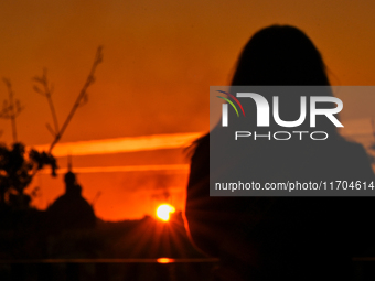 The sun sets over the skyline of Lviv in Lviv, Ukraine, on October 24, 2024. NO USE RUSSIA. NO USE BELARUS. (