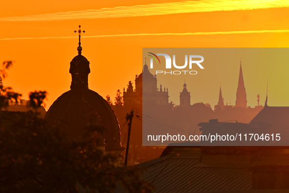 The sun sets over the skyline of Lviv in Lviv, Ukraine, on October 24, 2024. NO USE RUSSIA. NO USE BELARUS. 