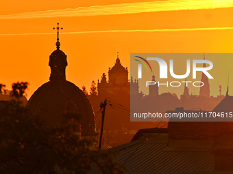 The sun sets over the skyline of Lviv in Lviv, Ukraine, on October 24, 2024. NO USE RUSSIA. NO USE BELARUS. (