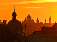 The sun sets over the skyline of Lviv in Lviv, Ukraine, on October 24, 2024. NO USE RUSSIA. NO USE BELARUS. (