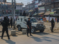 Indian security personnel stand guard along a road in Srinagar, Jammu and Kashmir, on October 25, 2024. Security is increased across Kashmir...