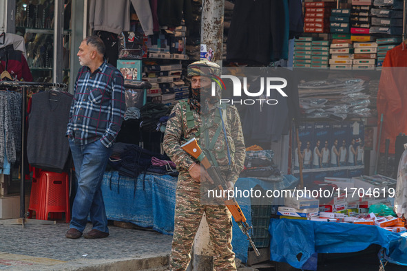 An Indian security personnel stands guard along a road in Srinagar, Jammu and Kashmir, on October 25, 2024. Security is increased across Kas...