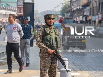 An Indian security personnel stands guard along a road in Srinagar, Jammu and Kashmir, on October 25, 2024. Security is increased across Kas...