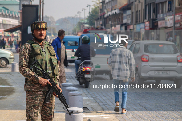 An Indian security personnel stands guard along a road in Srinagar, Jammu and Kashmir, on October 25, 2024. Security is increased across Kas...