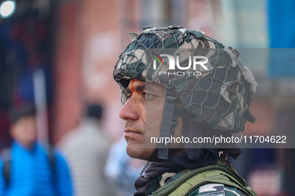 An Indian security personnel stands guard along a road in Srinagar, Jammu and Kashmir, on October 25, 2024. Security is increased across Kas...