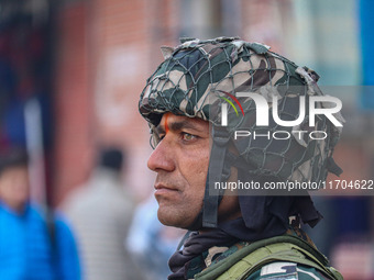 An Indian security personnel stands guard along a road in Srinagar, Jammu and Kashmir, on October 25, 2024. Security is increased across Kas...