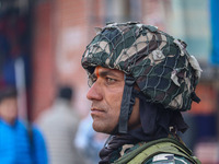 An Indian security personnel stands guard along a road in Srinagar, Jammu and Kashmir, on October 25, 2024. Security is increased across Kas...