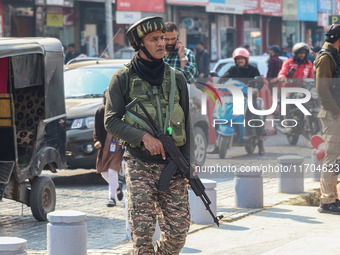 An Indian security personnel guards along a road in Srinagar, Jammu and Kashmir, on October 25, 2024. Security is increased across Kashmir f...