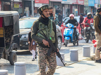 An Indian security personnel guards along a road in Srinagar, Jammu and Kashmir, on October 25, 2024. Security is increased across Kashmir f...