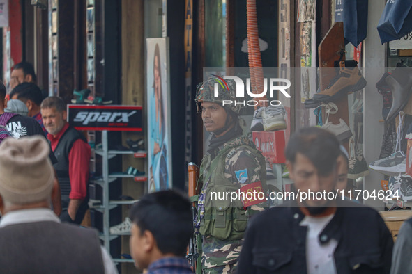 An Indian security personnel stands guard along a road in Srinagar, Jammu and Kashmir, on October 25, 2024. Security is increased across Kas...