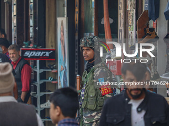 An Indian security personnel stands guard along a road in Srinagar, Jammu and Kashmir, on October 25, 2024. Security is increased across Kas...