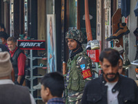 An Indian security personnel stands guard along a road in Srinagar, Jammu and Kashmir, on October 25, 2024. Security is increased across Kas...