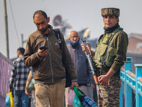 An Indian security personnel stands guard along a road in Srinagar, Jammu and Kashmir, on October 25, 2024. Security is increased across Kas...