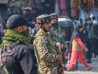 Indian security personnel stand guard along a road in Srinagar, Jammu and Kashmir, on October 25, 2024. Security is increased across Kashmir...