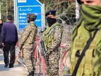 Indian security personnel stand guard along a road in Srinagar, Jammu and Kashmir, on October 25, 2024. Security is increased across Kashmir...