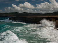 Andicuri Bay is a wide bay enclosed by coral-stone cliffs, some of which provide a little shade. Due to its perfect waves and stronger surf,...